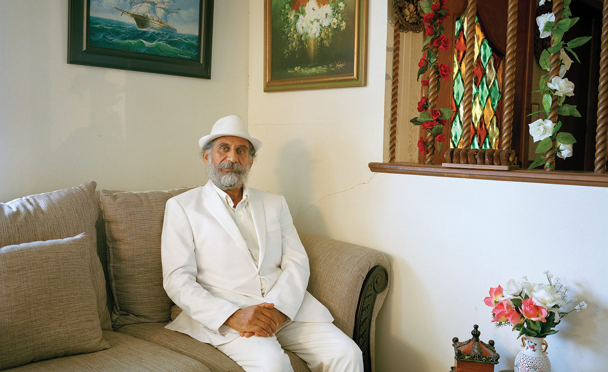 Shahram Ebadfardzadeh, a Mandaean religious and community leader, at home in San Antonio. He and his family left Iran nearly a decade ago after being persecuted for their faith. Being Mandaean restricted his ability to go to school and find a job. He says that Texas is a good place for him and his family because it has one of the largest populations of Mandaeans in the country: “When you see some faces you know, you don’t feel alone.”