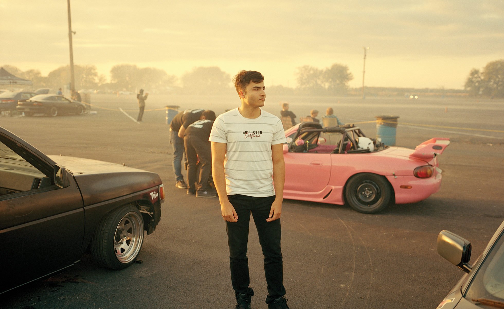 David Keshmiri, 18, attends a car race at the San Antonio Raceway in November 2019. Keshmiri, who works at a car dealership and is studying for a business degree at Alamo College, has a passion for cars and hopes to join those who race on the track every month. He and his family arrived in the United States from Iran when he was 12.