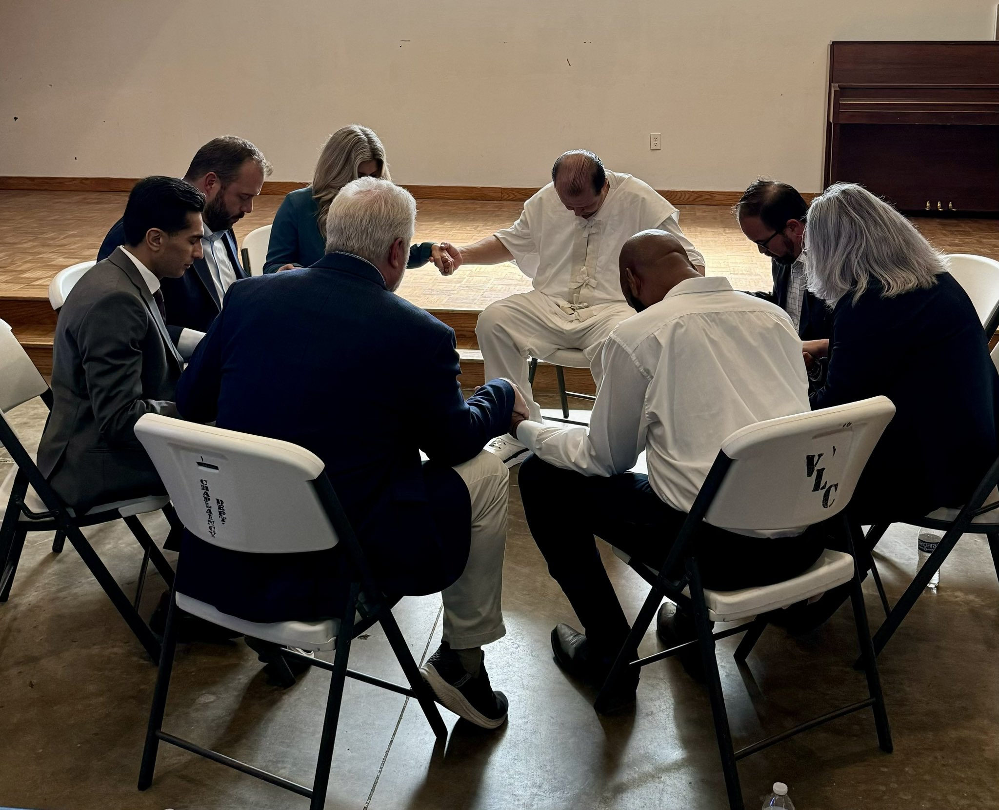 Robert Roberson praying with lawmakers while his execution date approaches